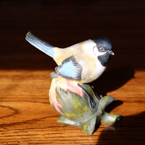 Chickadee on nut figurine